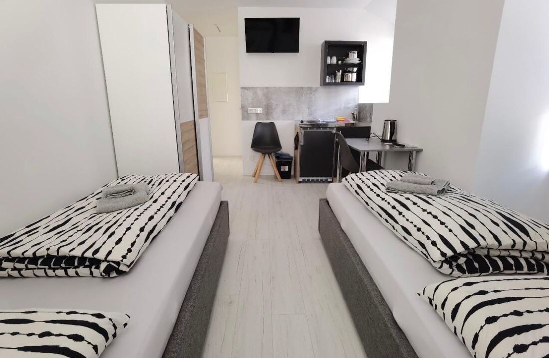 Apartment mit zwei Einzelbetten und Küchenzeile